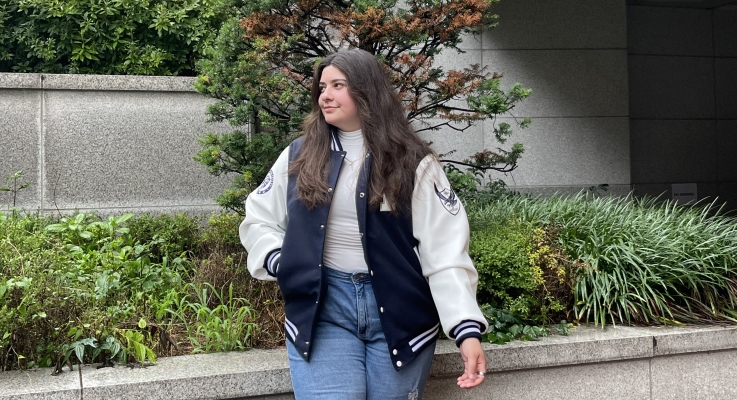 Ashley showing her school spirit in a letterman jacket