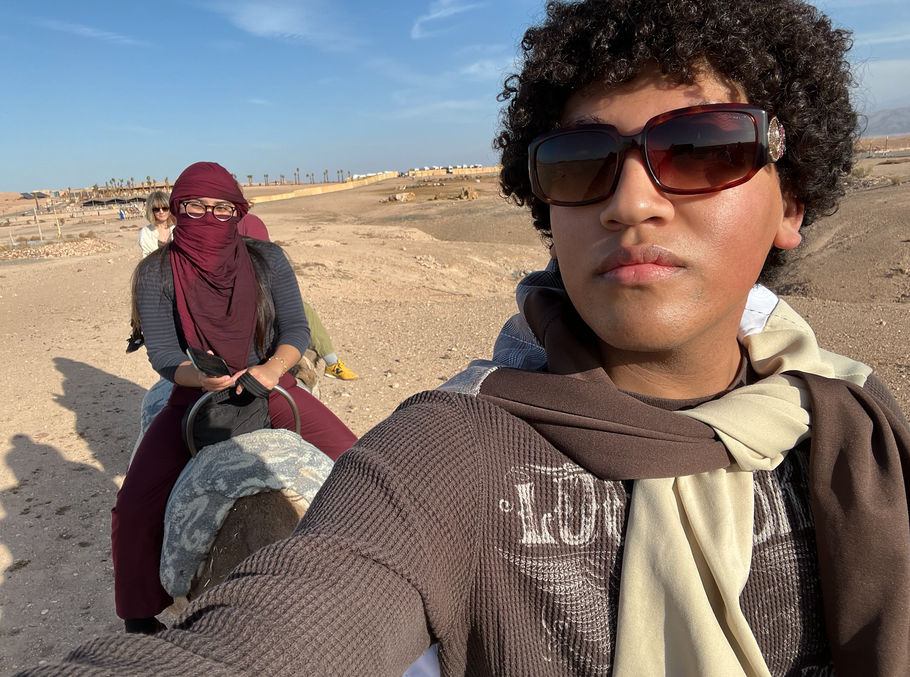 Ivan and Friends Riding Camels in Agafay Desert in Morocco