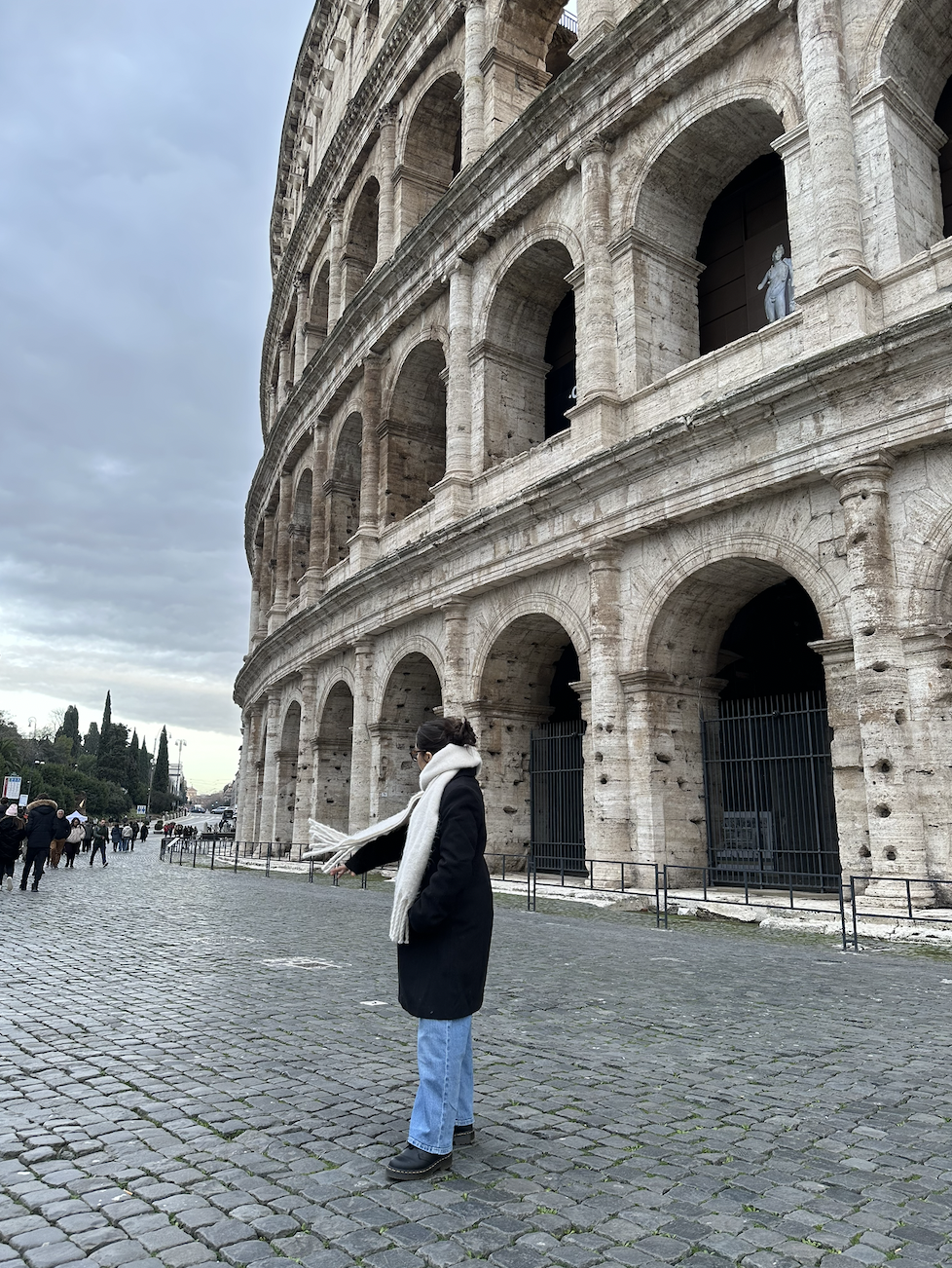 Leslie in front of Colosseum in Rome Italy during January