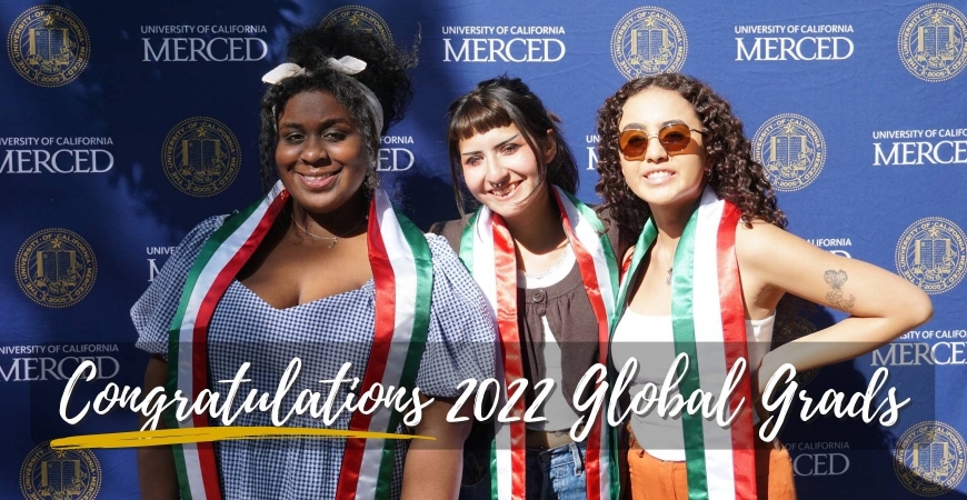 Three fall 2021 Italy participants pose together with their Italy graduation stoles at Global Grad 2022