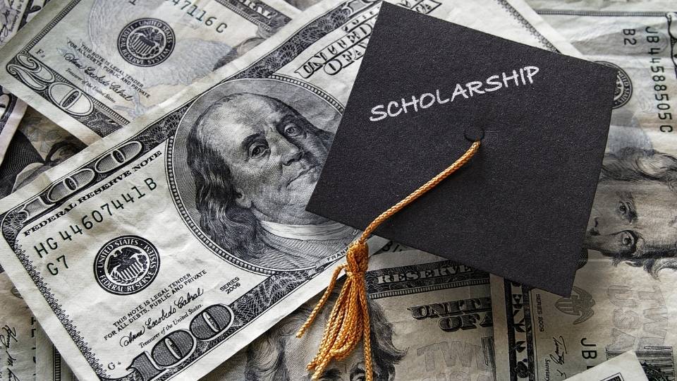 Explore scholarships-mini mortar board and US bills