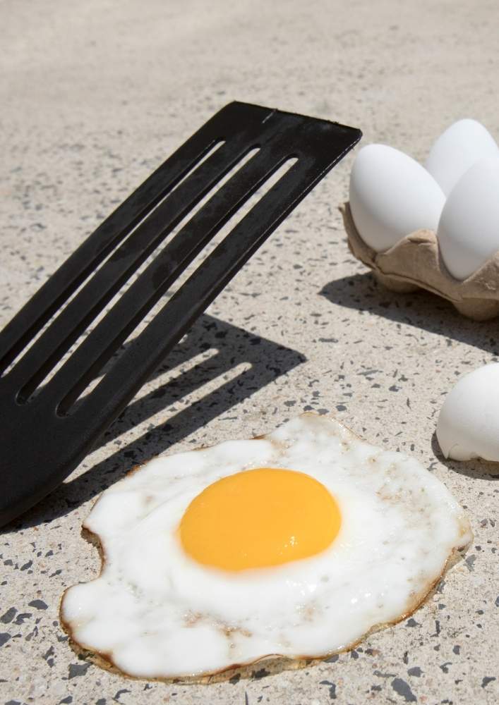 Egg frying on the sidewalk