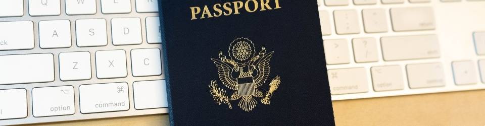 USA Passport over a computer keyboard