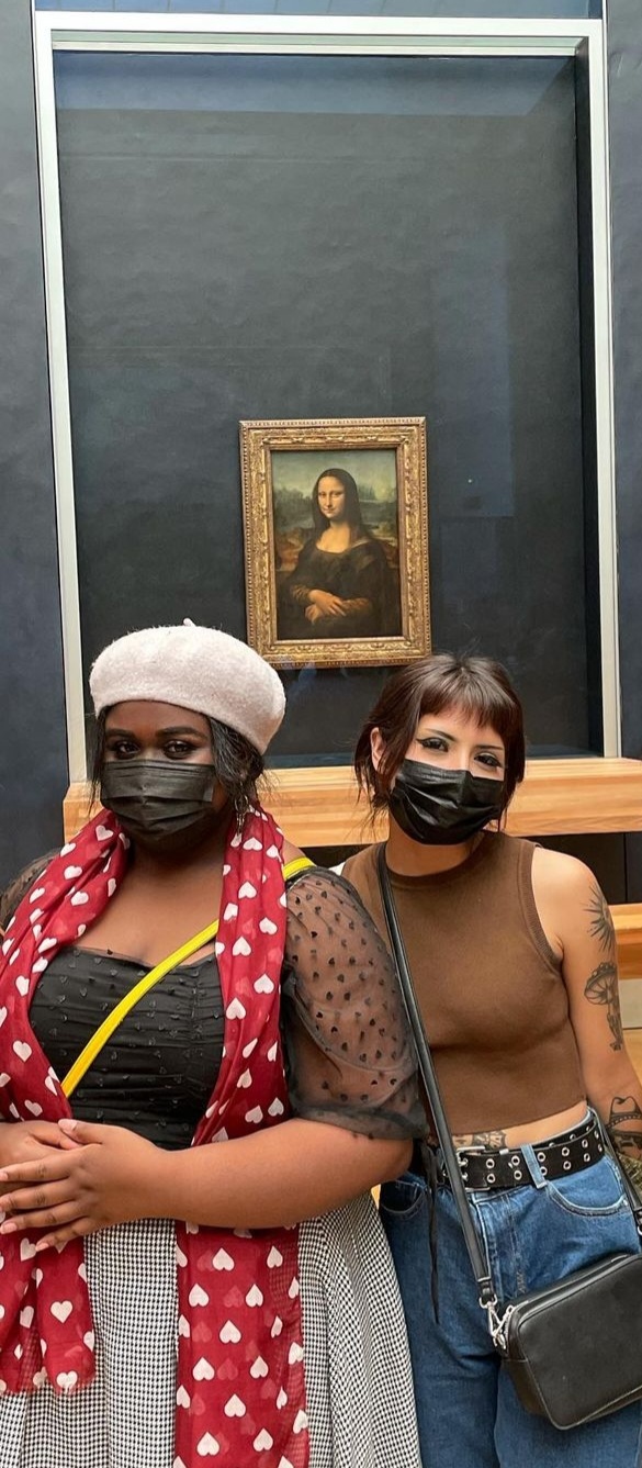 Myself and Daisy Cendejas taking a photo with the Mona Lisa at the Louvre!